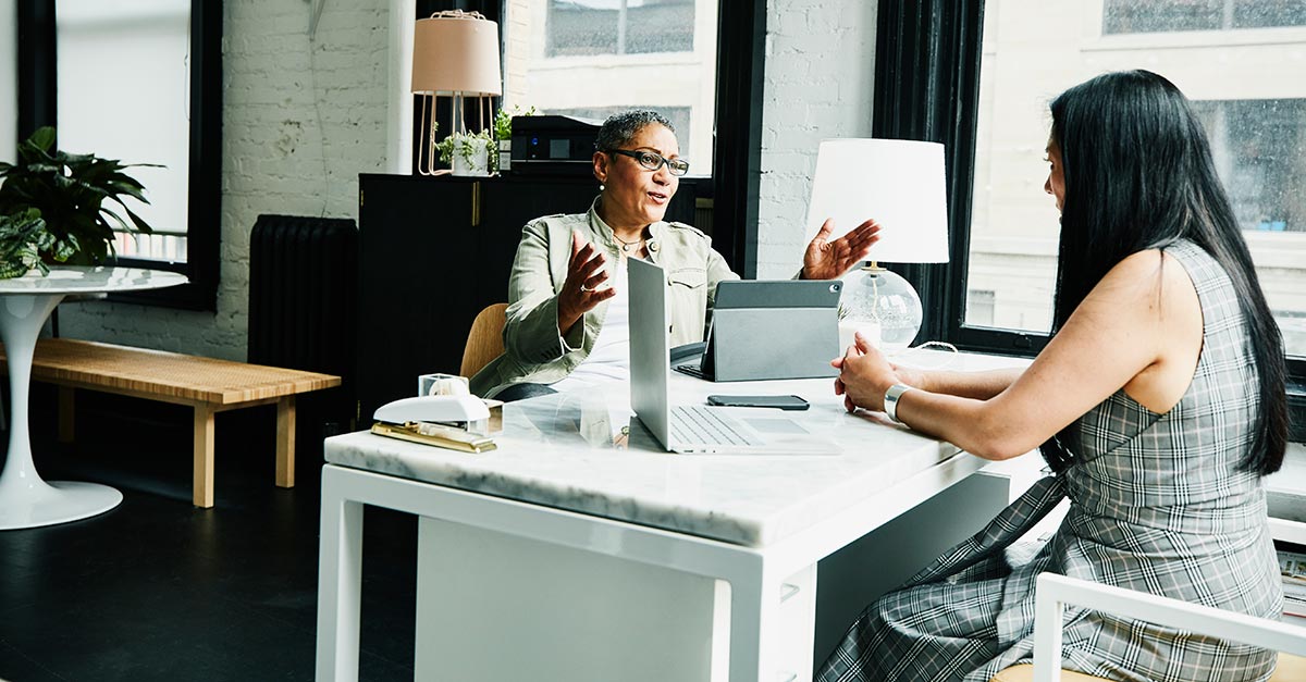 Financial Advisor In Discussion With Client 1200 x 627